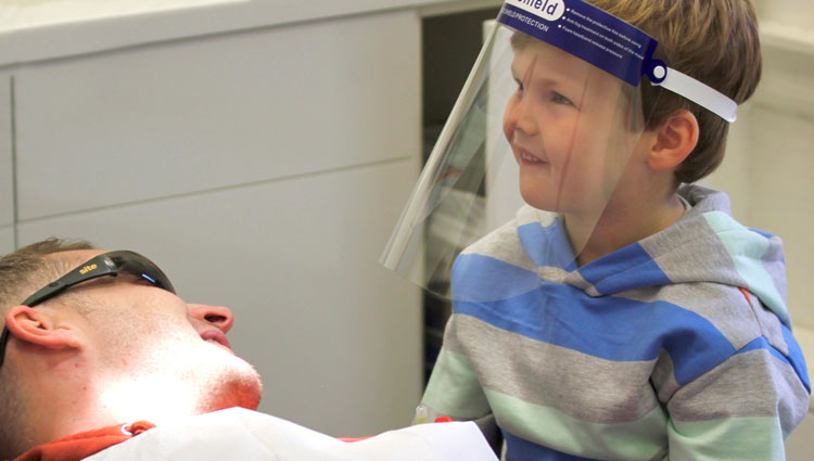 boy with parent in dental surgery
